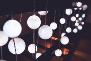 Soft ambient string lighting with spherical bulbs, ideal for creating a calming, sensory-friendly environment in neuroinclusive workspaces